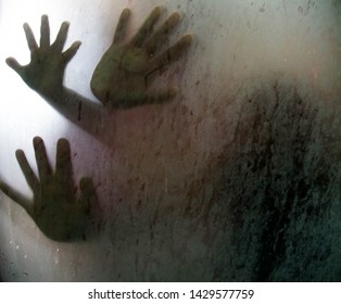 Hand  On Glass Shower Door
Stands Behind Steam Blurred Glass With Water Drops. Rest At Bathroom 