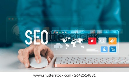 Hand on a mouse interacting with a virtual screen displaying "SEO," a world map and various digital marketing icons. Concept of Web optimization, online content strategy and global business promotion