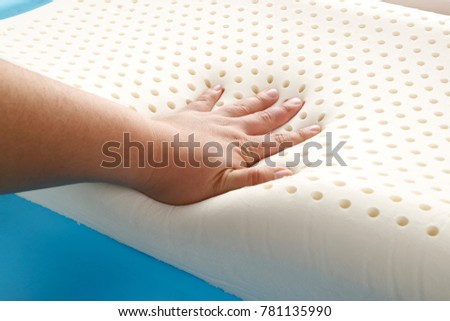 hand on orthopedic pillow, closeup