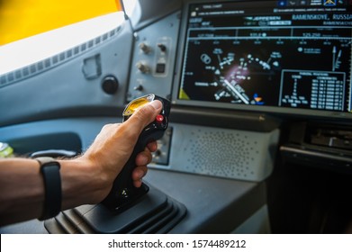 Hand on sidestick control of airplane - Shutterstock ID 1574489212