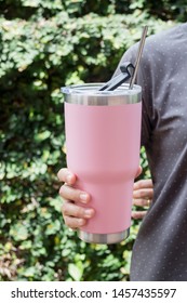 Hand On Thermos Tumbler Mug With Metal Drinking Straw, Stock Photo