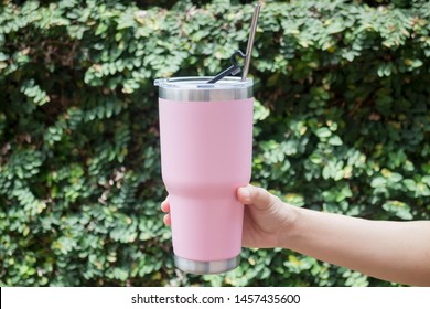 Hand On Thermos Tumbler Mug With Metal Drinking Straw, Stock Photo