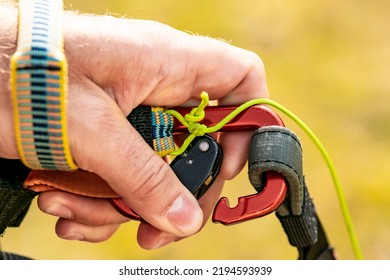 A Hand With An Open Carabiner