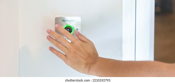 Hand Open The Door By No Touch Sensor Switch On The Wall At Office Or Apartment. Contactless, Modern, Technology And Safety Concept