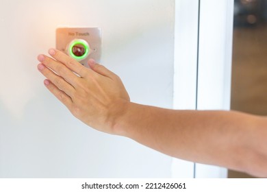 Hand Open The Door By No Touch Sensor Switch On The Wall At Office Or Apartment. Contactless, Modern, Technology And Safety Concept