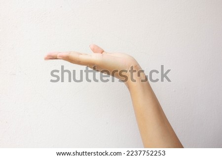 Hand open and ready to help or receive. Gesture isolated on white background with clipping path. Helping hand outstretched for salvation.