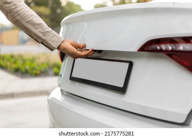 Hand Opening The Back Door Of The Black Car.