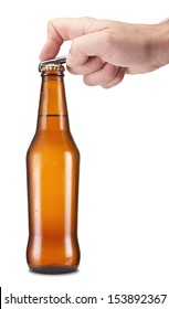 A Hand Opening A Bottle Of Beer.