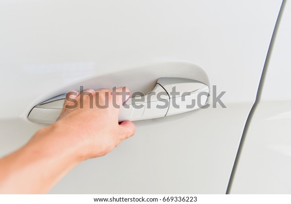 Hand Opening a Car Door\
Handle