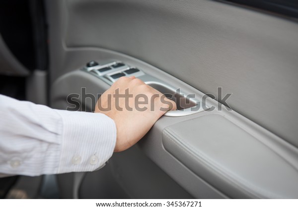 Hand opening car\
door ,hand on holding a\
car