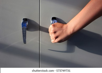 The Hand Is Opening The File Cabinet.