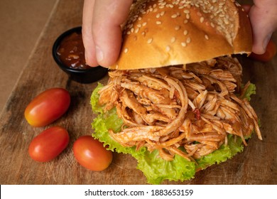 Hand Opening Homemade Shredded Chicken Sandwich