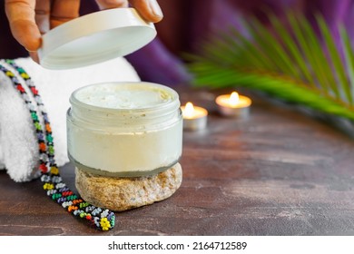 Hand Opening Jar Of Cream Or Body Butter 