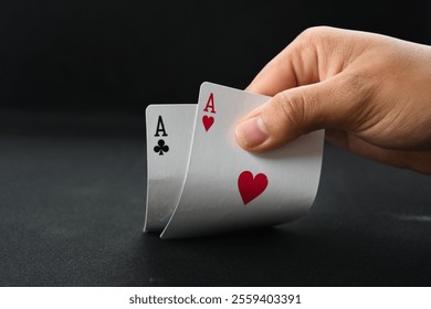 hand opening poke card illustration. peeking at the poker cards. pair of poker aces. playing poker cards dark black background - Powered by Shutterstock