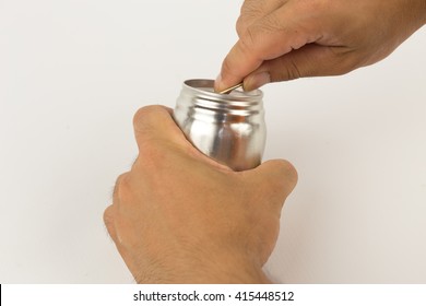 A Hand Opening Soda Or Beer Can. Isolated On White Background. Close Up Of Can Pull Tab Opening