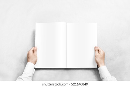 Hand Opening White Journal With Blank Pages Mockup. Arm In Shirt Holding Clear Magazine Template Mock Up. Man Reading Double-pages Book First Person View. Mag Layout Spread.