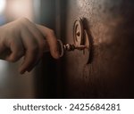 hand opens a heavy metal door with an antique key, archive, safe, top secret concept