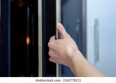 The Hand Opens The Oven Door. Kitchen Equipment.