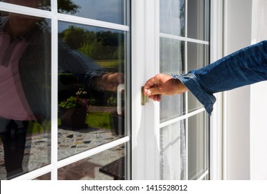 Hand Opens Pvc Balcony Door