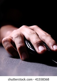 Hand Operating A Computer Mouse, Light And Dark