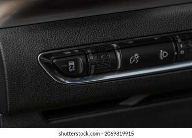 Hand Operating ESP (electronic Stability Program) Control Close Up View. Interior Detail Of A Modern Car. ESP Button.