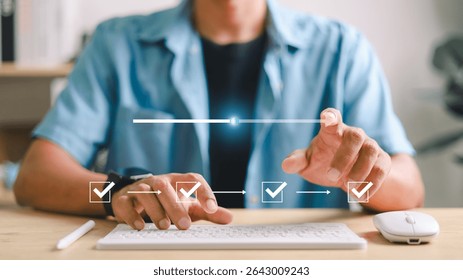 Hand operating keyboard with digital progress bar and checklist interface showing task completion steps. Concept of workflow automation, project tracking, and productivity tools.