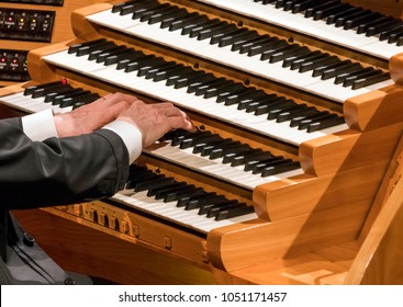 Hand Of Organist Playing On Organ