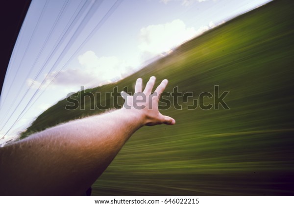 hand outside a moving\
car