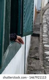 the hand outside of the window