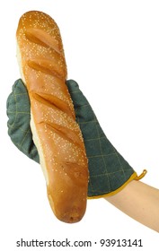 Hand In Oven Mitt Holding French Baguette On White Background