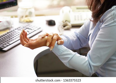 Hand Pain. Close-up Of An Office Worker. Hands Hurt. Close-up Of Woman's Hands With Painful Feeling In Joint. Hand Injury And Health Issues Concept.