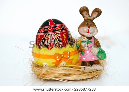 Hand painted Easter eggs. Traditional Easter decorations made by folk craftsmen from Bucovina, Romania. Painted Easter models, the sign of the cross and. Bunny decoration. Happy Easter