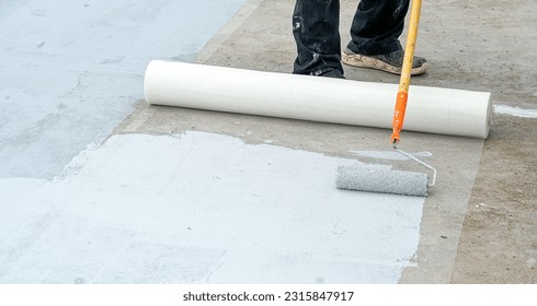 Hand painted gray flooring with paint rollers for waterproof, reinforcing net,Repairing waterproofing deck flooring. roof.