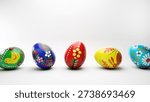 Hand painted local folk easter eggs on a white background.