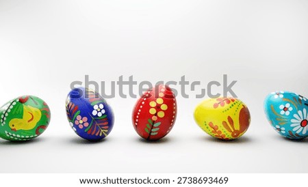Hand painted local folk easter eggs on a white background.