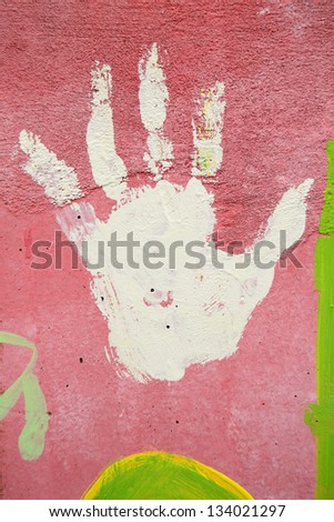 Hand painted on wall. Multicolor and vertical banner. Young people signal