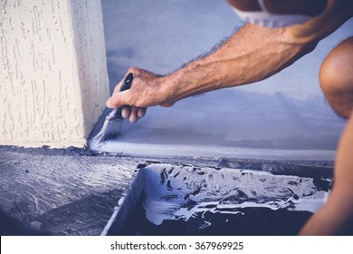 Hand Painting Garage Floor, Soft Selective Focus, Toning