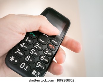 Hand Palm Holding Big Push Button, Simple Mobile Phone For Seniors.