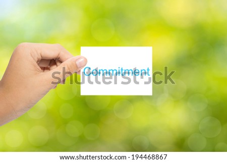 Hand with paper commitment