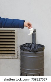 hand with paper pulling to the trash