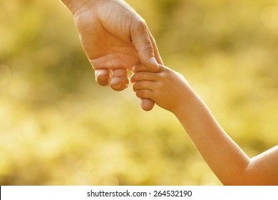 Hand Of Parent And Child