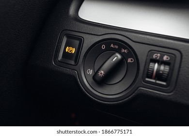 Hand parking break button panel in car