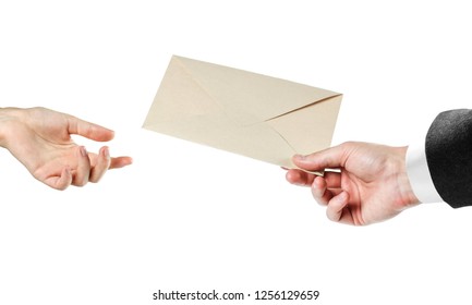 The hand passes the envelope. Close up. Isolated on white background. - Shutterstock ID 1256129659