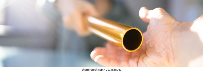 Hand Passing Golden Relay Baton To Businesswoman - Shutterstock ID 2114856041