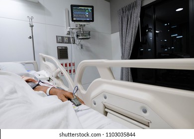 Hand Of Patient Lying In Bed In Icu Room In Hospital