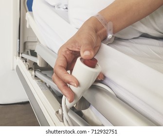hand of patient pressing emergency button at hospital - Shutterstock ID 712932751