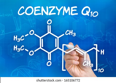 Hand With Pen Drawing The Chemical Formula Of Coenzyme Q10