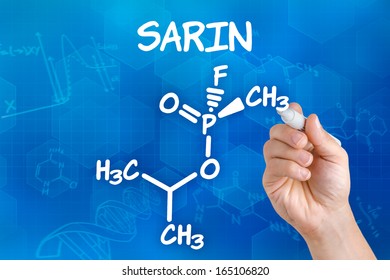 Hand With Pen Drawing The Chemical Formula Of Sarin