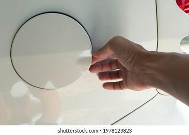 Hand Of People Attach Car Oil Cap On Car White Color.