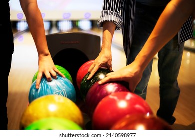Hand people picking out the right bowling ball is very important! leisure, date night, competition, activity,